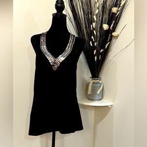 No Brand listed. Black halter top with silver bead accents at the neck. Medium
